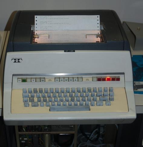 A Teletype Model 37, with some buttons illuminated.