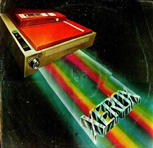 The cover of Xerox de Colombia's Volumen 9 album. Over a backdrop of stars in deep space, what appears to be an early dot matrix printer (though in reality it might be a copier of some kind) flies in from the top left corner. It is beige with vents and a chunky chrome knob in front, and some panels that cover most of the top are a bold red. The machine looks very cassette futurist, especially with the sharp corners and the style of painting. The front of the machine is shooting out two red-yellow-green beams of futuristic energy toward the bottom right corner of the artwork, and on the beams slides a 3D airbrush-chrome XEROX logo. Looking at the art should leave no question in the viewer's mind that the album comes from 1980.