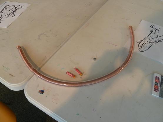Using an AAA Battery, 4 neodymium magnets and a copper coiled tube (inside the plastic tube), the idea is to build a train that can be inserted in to one end of the tube, and it emerges from the other end, under its own power.
