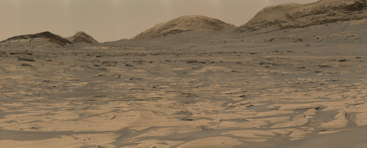 An ochre toned image capturing a Martian landscape.