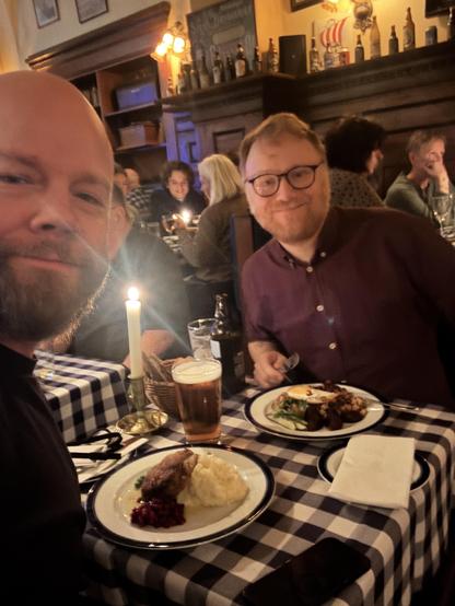 Me and Patrik at a restaurant table in Stockholm