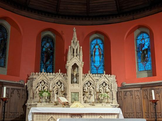 A neogothic high altar in a Catholic church prepared for Mass