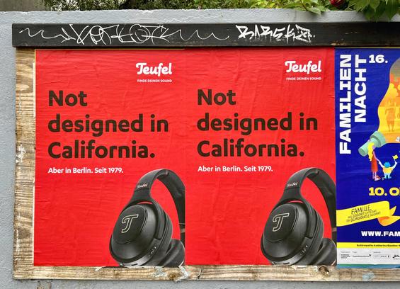 Ad for Teufel headphones saying "Not designed in California. Aber in Berlin. Seit 1979"