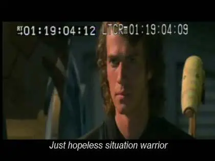 still from "Backstroke of the West", a circa-2005 english translation of Star Wars episode III: Revenge of the Sith that was run through a translator multiple times (English to Chinese to English? at the very least) to produce a constant stream of wacky English terminology. here, Anakin Skywalker ("Allah Gold") is shown, with timecode along the top because this was a screener or something, with the subtitle "Just hopeless situation warrior", which I believe is translating the concept of "Jedi Knight".