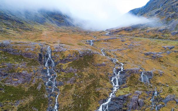 Burns in full spate creating waterfalls.