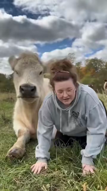Adorable video about a lady hugging a cow and even a boop!