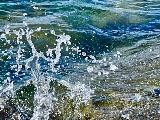 Water splashes against the shore of Lake Tahoe.