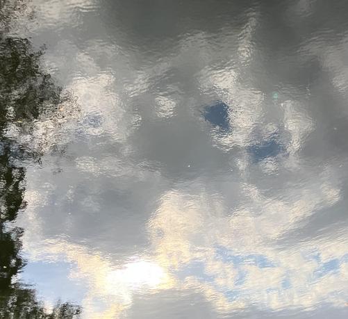 Reflection of clouds in a river, cropped to eliminate the context.