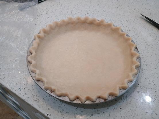 Pie crust two, in a metal pie pan.