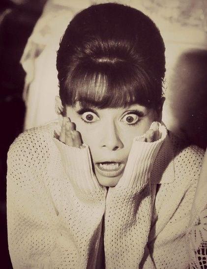 Audrey, eyes wide with terror, clasps her hands to her face as she discovers toast toasting round side down.
