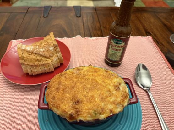 A picture of a Würzfleisch, some bread and Worcester sauce.