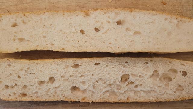 A lengthwise cut of one of the baguettes, showing the mie as somewhere between what it should be, and white bread.