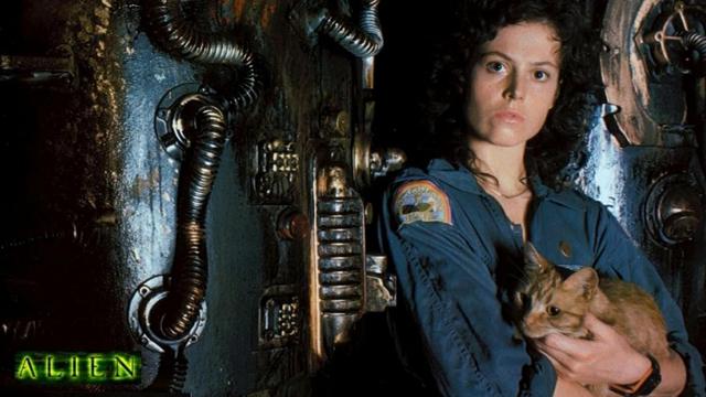 A promotional poster for the movie Alien showing Sigourney Weaver in role, holding her ginger cat
