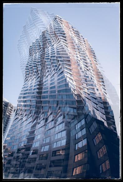 A silly, composite photograph of Mira near the San Francisco waterfront. Mira is a twisty, 40-story, luxury condominium building at Folsom and Spear designed by Studio Gang in 2020. It has floor plates that are rotated slightly as the building rises up, creating a sense of motion and giving each condominium owner a unique view from their windows and balconies. Shoulda been taller, IMHO. Anyway, two bedroom condos cost around $2M... And amenities include doormen, valet parking, a gym, and hot and cold running water. 

Photographically, this is a blend of four separate photos taken while I was wandering around the building's base, looking up from the sidewalk. The blend makes the building look even more twisty than it really is.