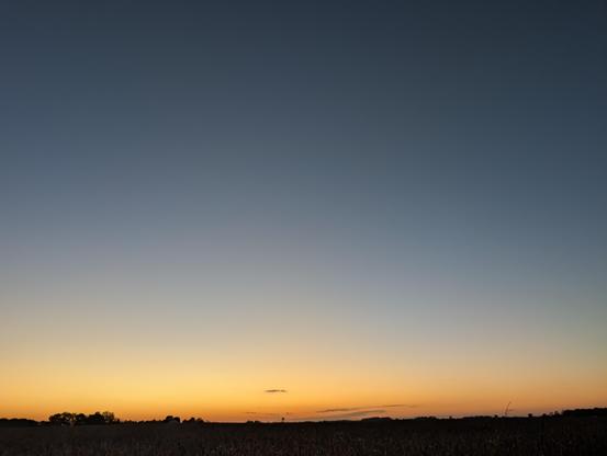 Sunset over the corn field. These are going to run out soon, I am definitely moving into a can, down by the river. So, the view will change, but not the intention. One little bit of pretty, available as an antidote for the common day. Pale peach fades yellow then blue to dark blue.