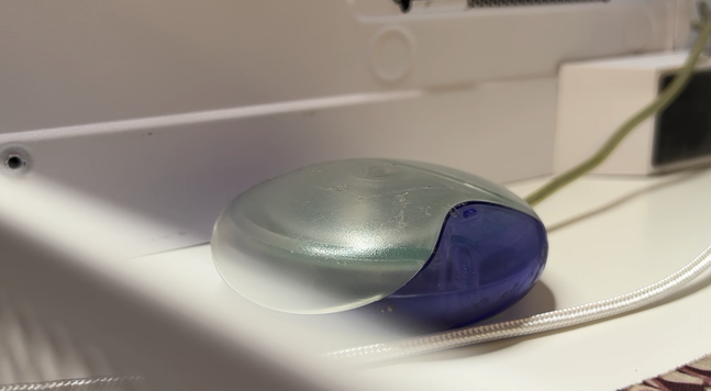 an imac g3 hockey puck mouse