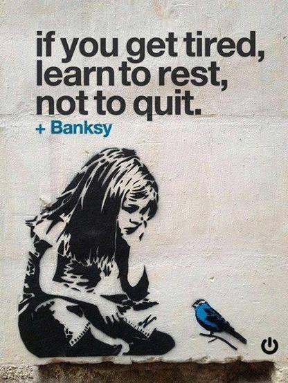 Possibly a Banksy mural? Little girl sitting cross legged watching a bluebird.
Caption: if you get tired learn to rest, not to quit.