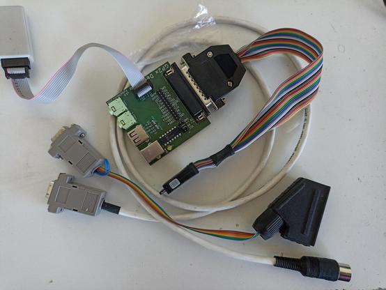 Gp2x breakout board, 1084s DIN RGB to VGA and VGA to SCART passive cable now with the cases on the connectors. I was long out of stock and had been using no casing or larger casing on smaller connectors until now, just reordered and received some.

(It still looks sketchy: some of the cables are not hroper shielded ones but rainbow flat cable, some have the insulation "repaired" with heatshrink tube, one has a wire loop that goes out of the casing and back in)