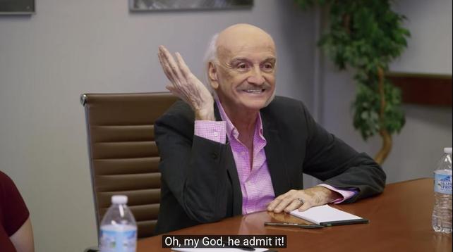 "Focus Group Man" (played by Ruben Rabasa) from the I Think You Should Leave sketch: an older man sitting at a conference table gestures and smiles. subtitle: "Oh, my God, he admit it!"