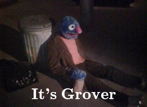 Text "It's Grover" over a guy in a Grover (from Sesame Street) costume sitting in front of a trash can with a paper bag concealing a drink