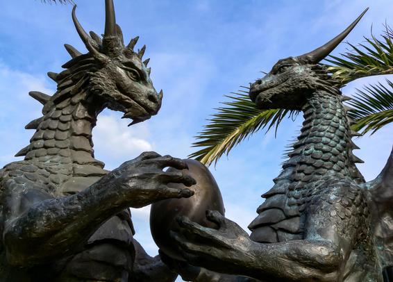 The Dragons In Love statue, with two dragons gazing at each other lovingly and holding an egg between them. This one is a close-up photo of the dragons' faces.
