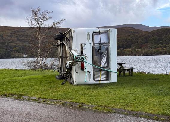 Caravan on its side.