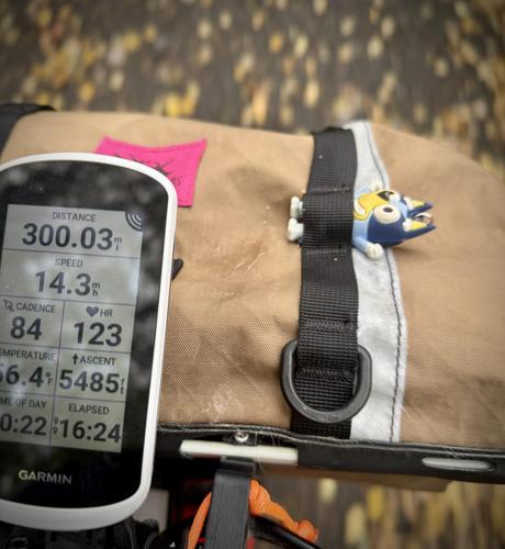 Late morning photo of gps showing 30” miles completed. In the front bag is a little plastic character I found.