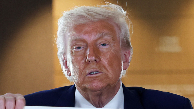 Trump with very orange make up skin