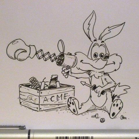Little Wile e. is building a contraption with Acme spares.