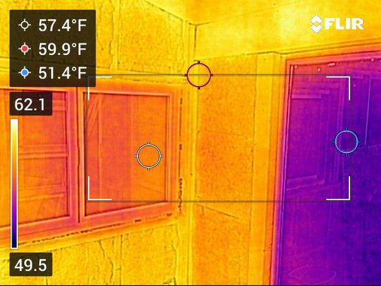 thermal image of two windows, one reading 57.4F and the other 51.4F