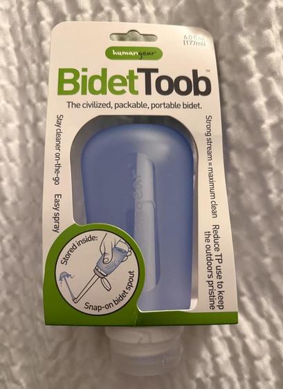 A hand sized collapsable bidet. It squirts water at nether regions instead of using lots of toilet paper, good if you end up using the bathroom a lot because of "the guts".