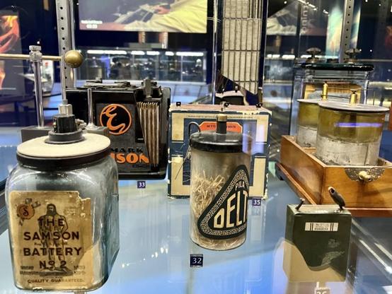 A selection of batteries at the Museum of Science in Chicago including:
THE SAMSON BATTERY No2 (quality guaranteed)
PILA DELTA (looks more like used pencil sharpener)
Something "mark" (trademark?) Edison
And some random glass jars with electrodes along with a battery in colored cardboard we can't really make out.