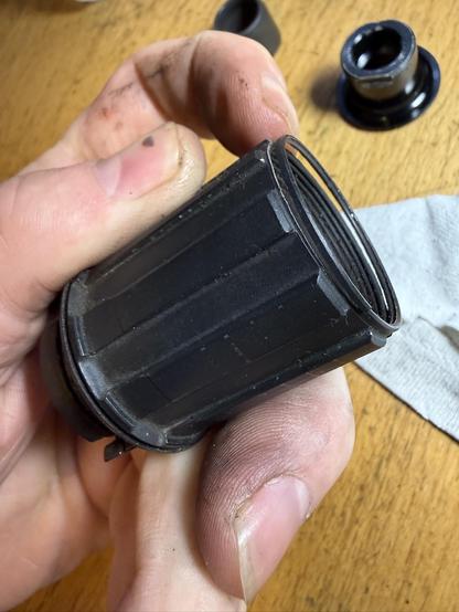 Shimano HG freehub body with 3 pawls, the threaded end has separated along thread lines