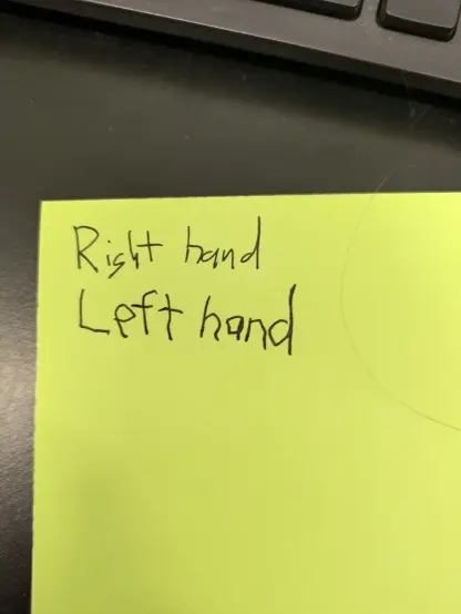 A messy but normal set of writing saying right hand, followed by a large and shaky but perfectly legible set of texts saying left hand