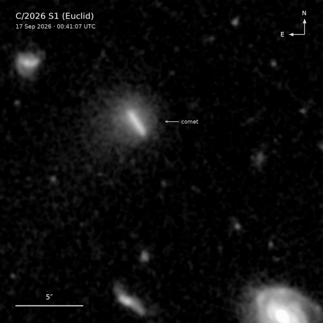 A comet appears as a moving streak against a backdrop of galaxies in this black and white animated image.