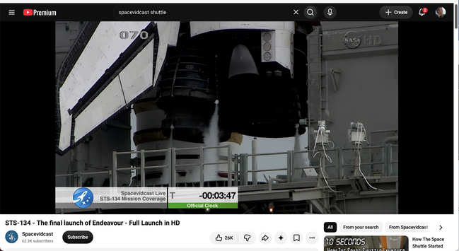 A youtube browser window in theater mode, narrowed vertically. The video (of a Space Shuttle launch) is in about four-fifths of the available space. Black bars are on either side of the video.