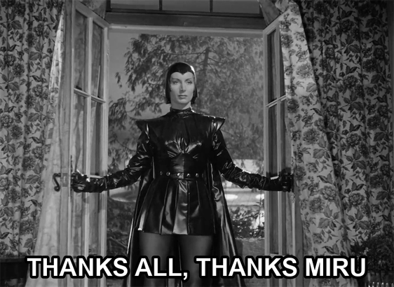 screenshot from the film Devil Girl From Mars showing a serious woman wearing a black leather suit, cape, and cowl. Text reads: "Thanks all, thanks Miru"