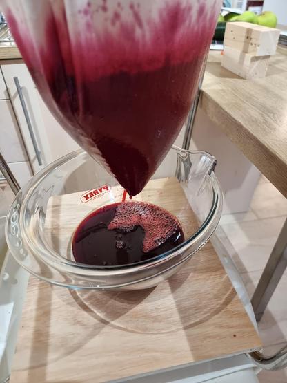 The deep red juice of brambles straining through a jelly bag hung, as tradition demands, from the legs of an upturned chair.